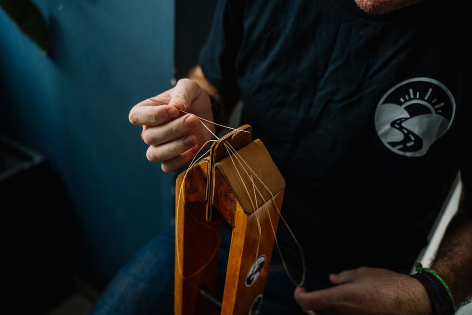 Artisan skillfully stitching a leather wallet using traditional hand tools.